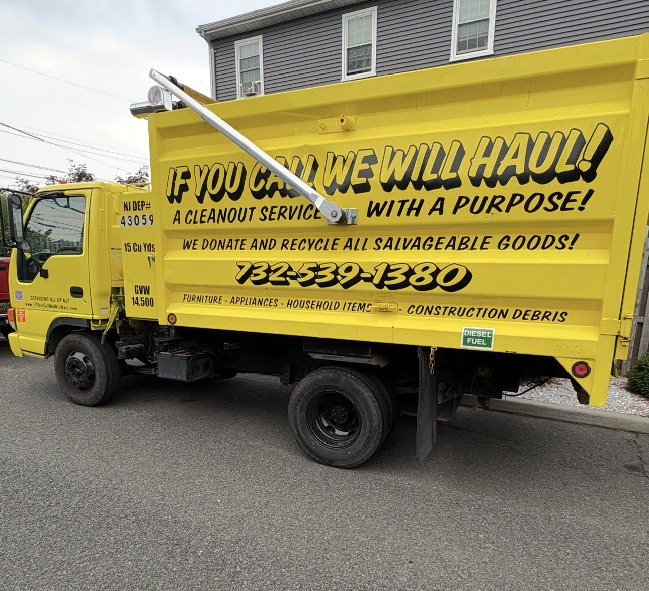 If You Call We Will Haul dump truck parked on a residential street in New Jersey